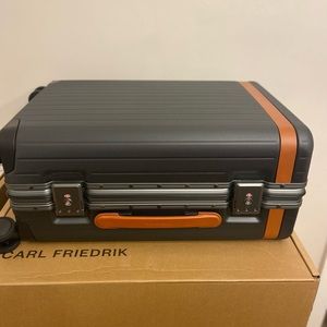 Carl Friedrik Carry-On Suitcase. Cognac leather color. As seen in Succession